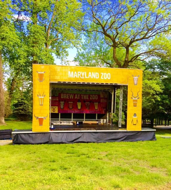 Maryland Zoo Brew at the Zoo Apex stage, yellow branded, in a park setting