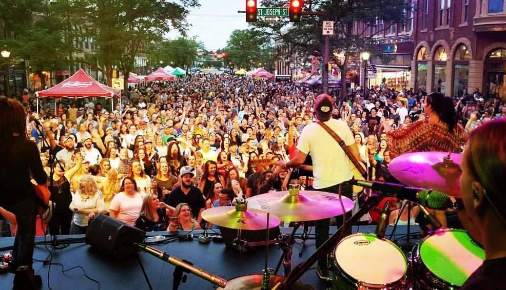 View from stage at packed street festival crowd at St. Joseph Street corner