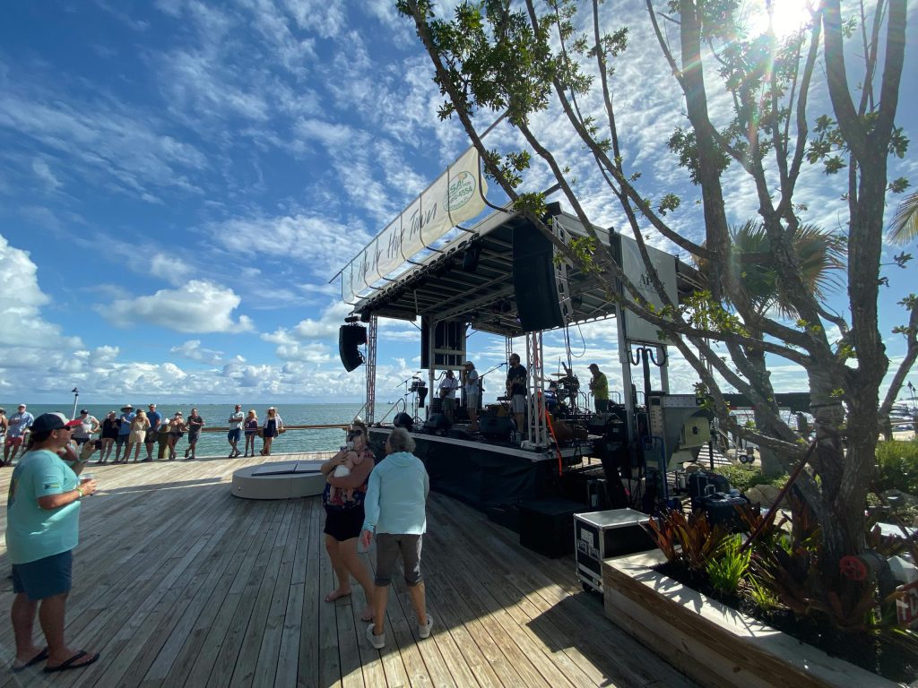 Apex stage on a waterfront boardwalk in a coastal Florida setting on a sunny day