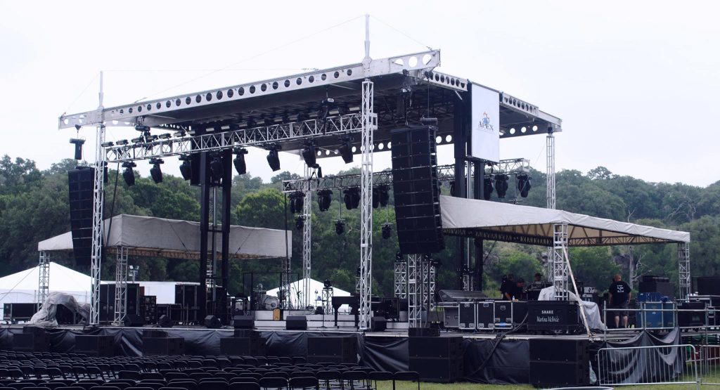 Apex Stages 42x20 concert stage fully deployed at outdoor festival, Martina McBride setup