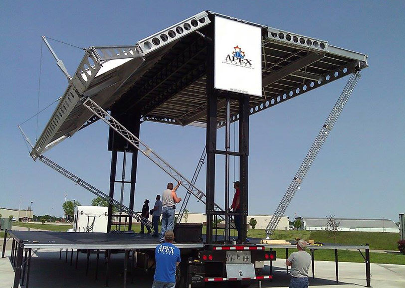 Apex Stages crew assembling a mobile stage during training