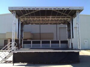 APEX 2016 mobile stage set up empty outside the Apex Stages facility, showing the open roof and bare deck