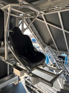 Operator seat mounted within the aluminium framing inside the APEX 2424 mobile stage structure