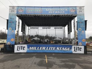APEX 3224 GEN5 mobile stage branded as the Miller Lite Stage for a street festival and pep rally