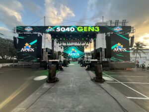 Front view of the APEX 5040 GEN3 mobile stage with Apex Stages branding across the LED side walls and header